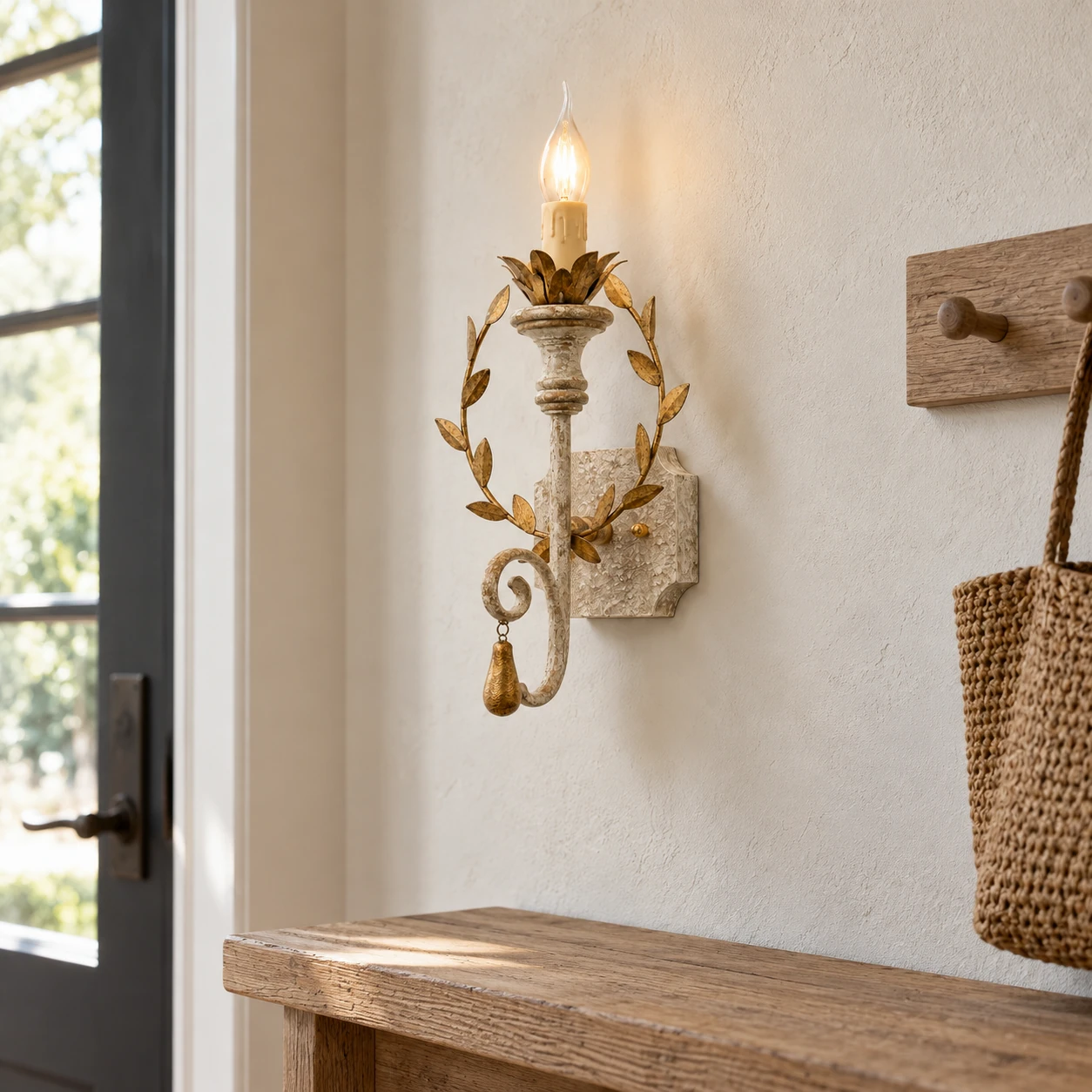 Nora rustic leaf-wreath wall sconce in a mudroom