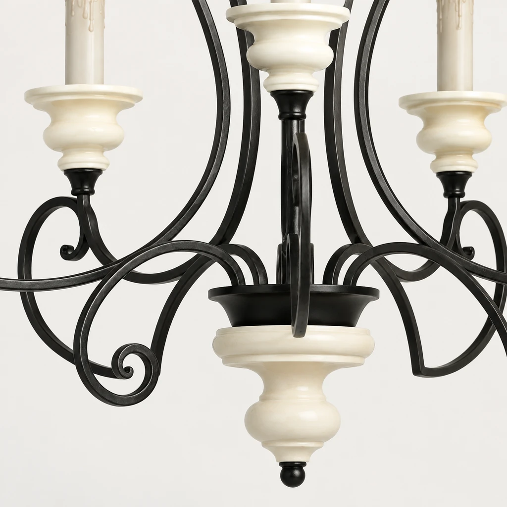 Close detail of black scroll iron and cream candle cup
