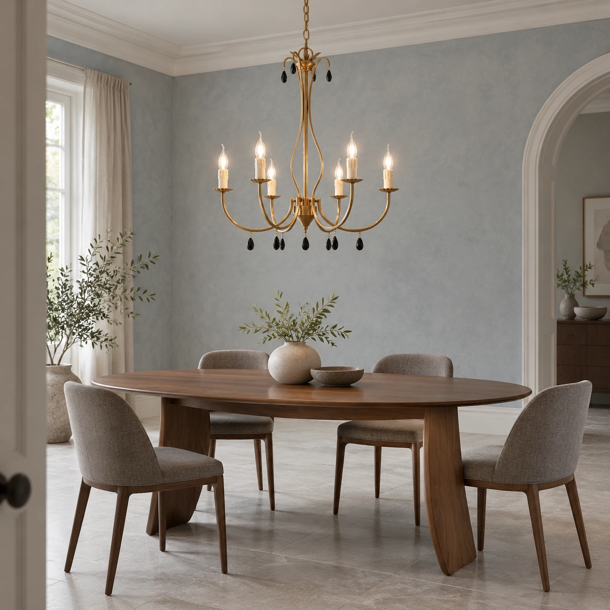Celeste vintage gold chandelier above a walnut table in a blue-gray dining room