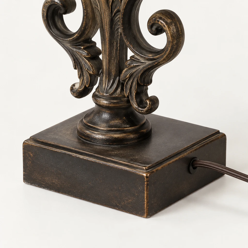 Close detail of the dark ornate curled frame and vertical supports