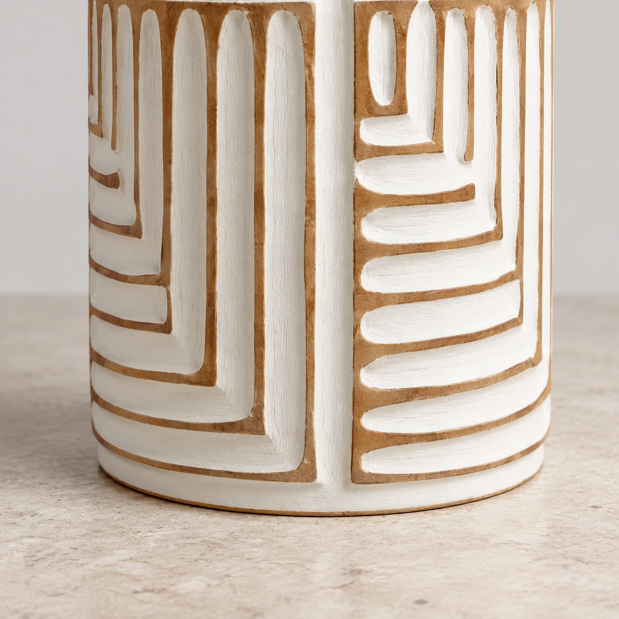 Close detail of the Odette lamp carved lower body and rounded base rim on stone