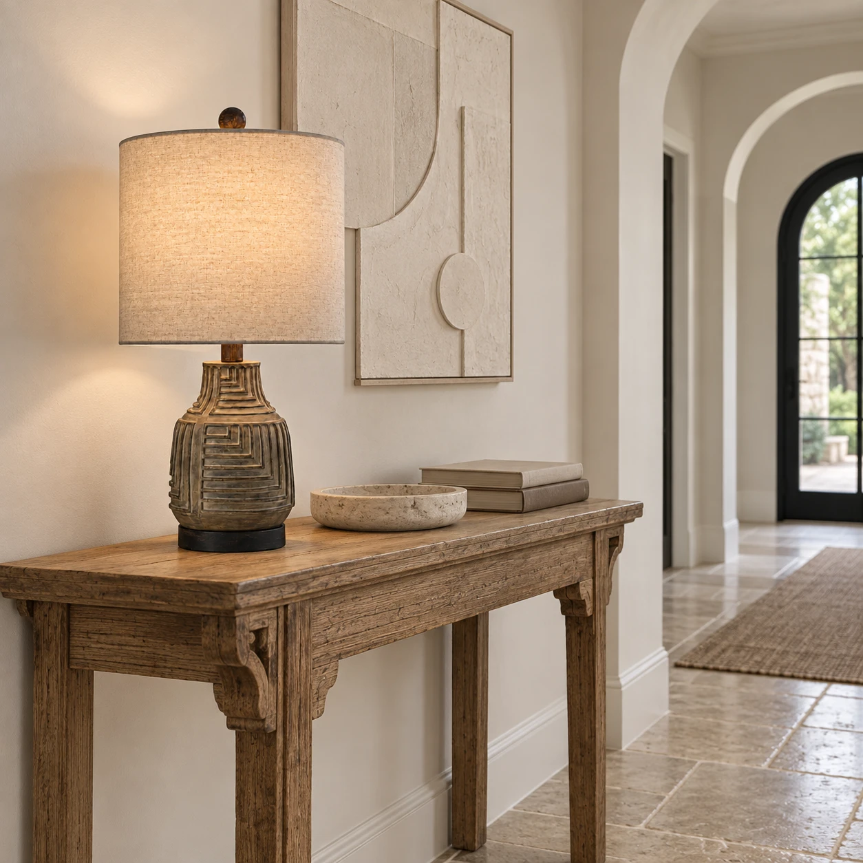 Carved wood table lamp on an entry console
