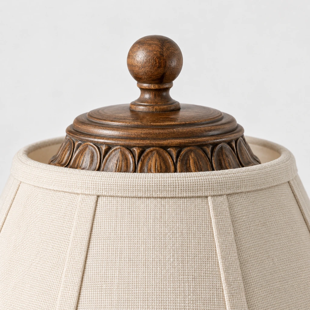 Close detail of the small top finial, shade cap and carved collar