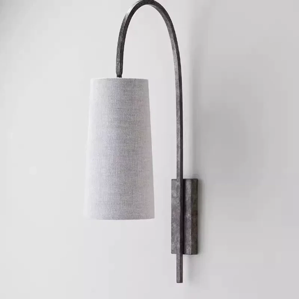 Antique Silver fabric wall sconce on a white background