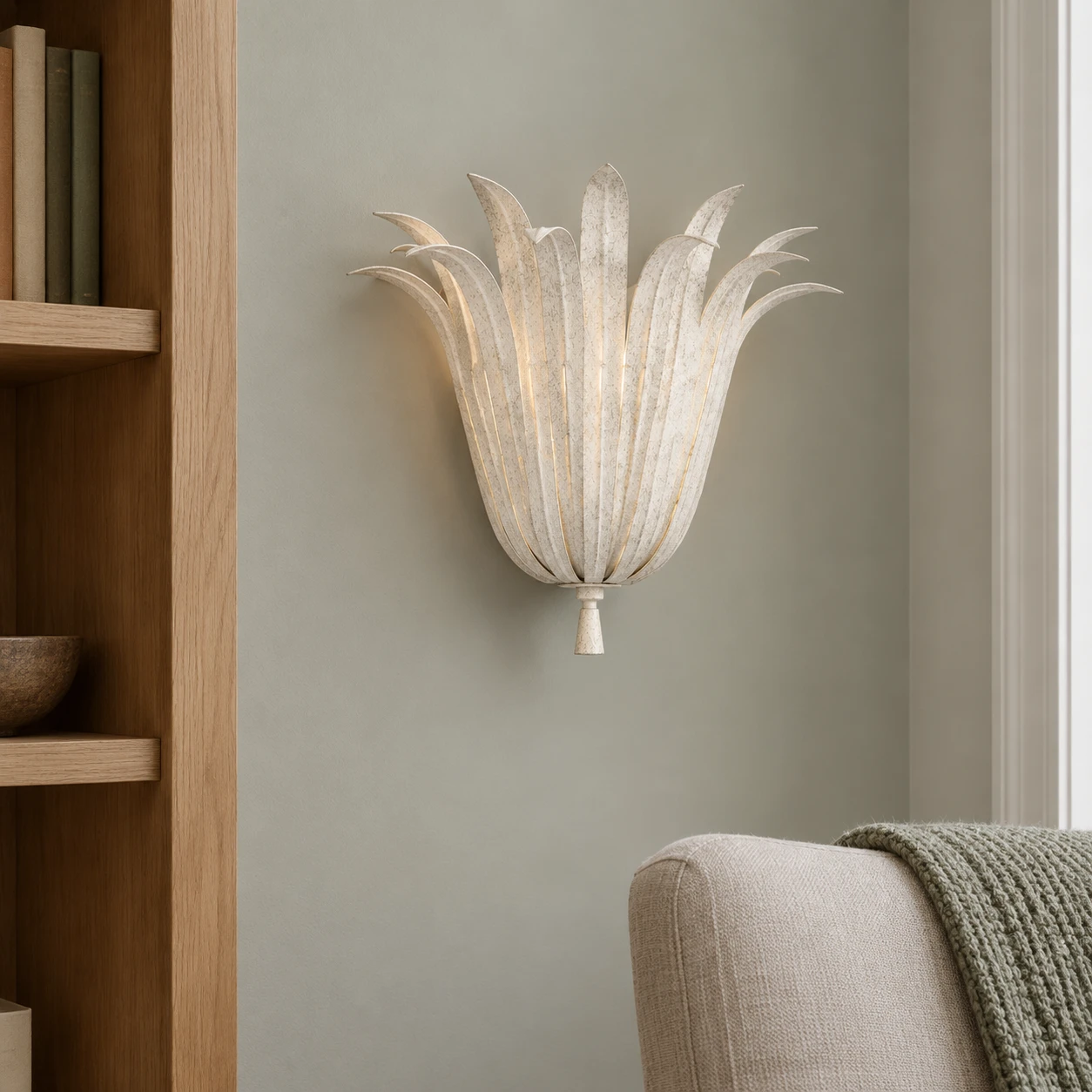 Vintage White wall sconce between a window and bookshelf