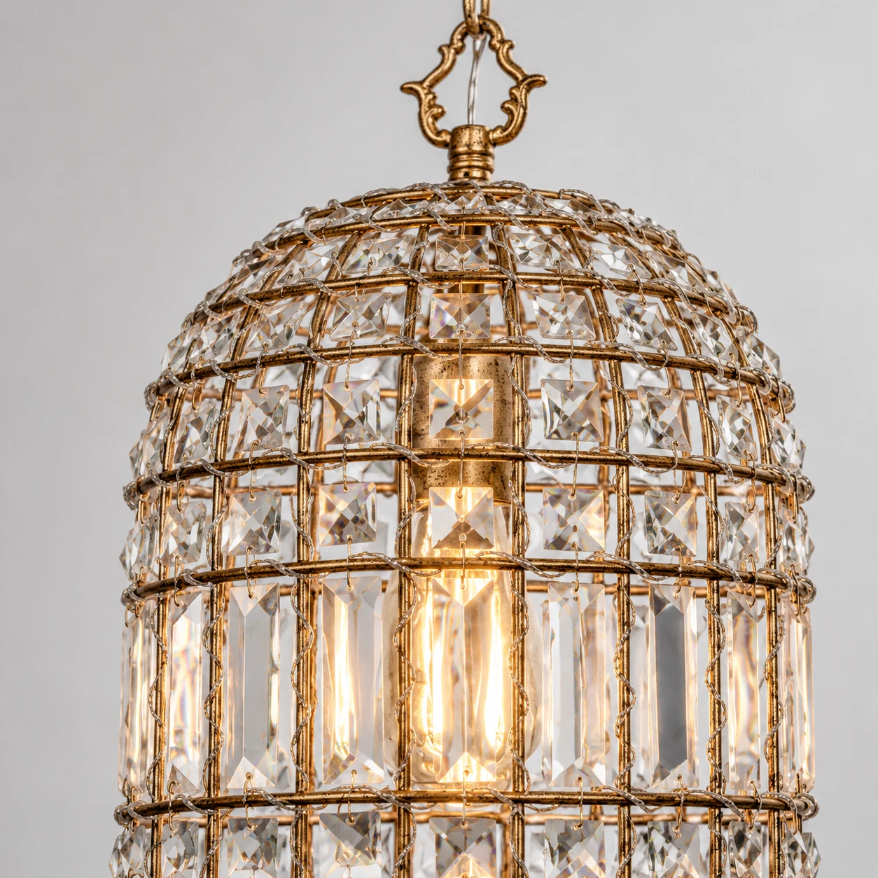 Clara faceted crystal and aged-gold cage lattice detail