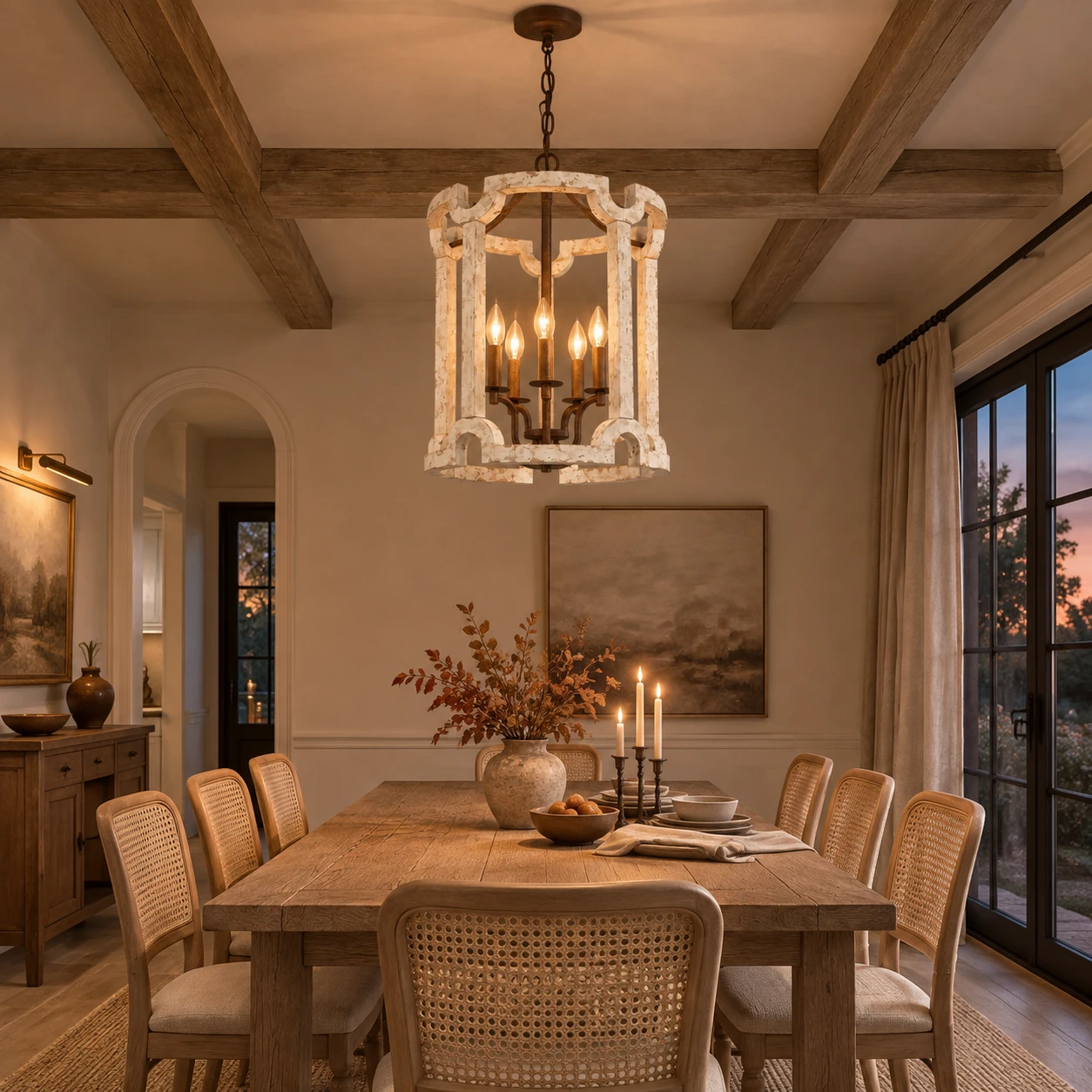 Carved wood birdcage chandelier above an oak dining table at dusk