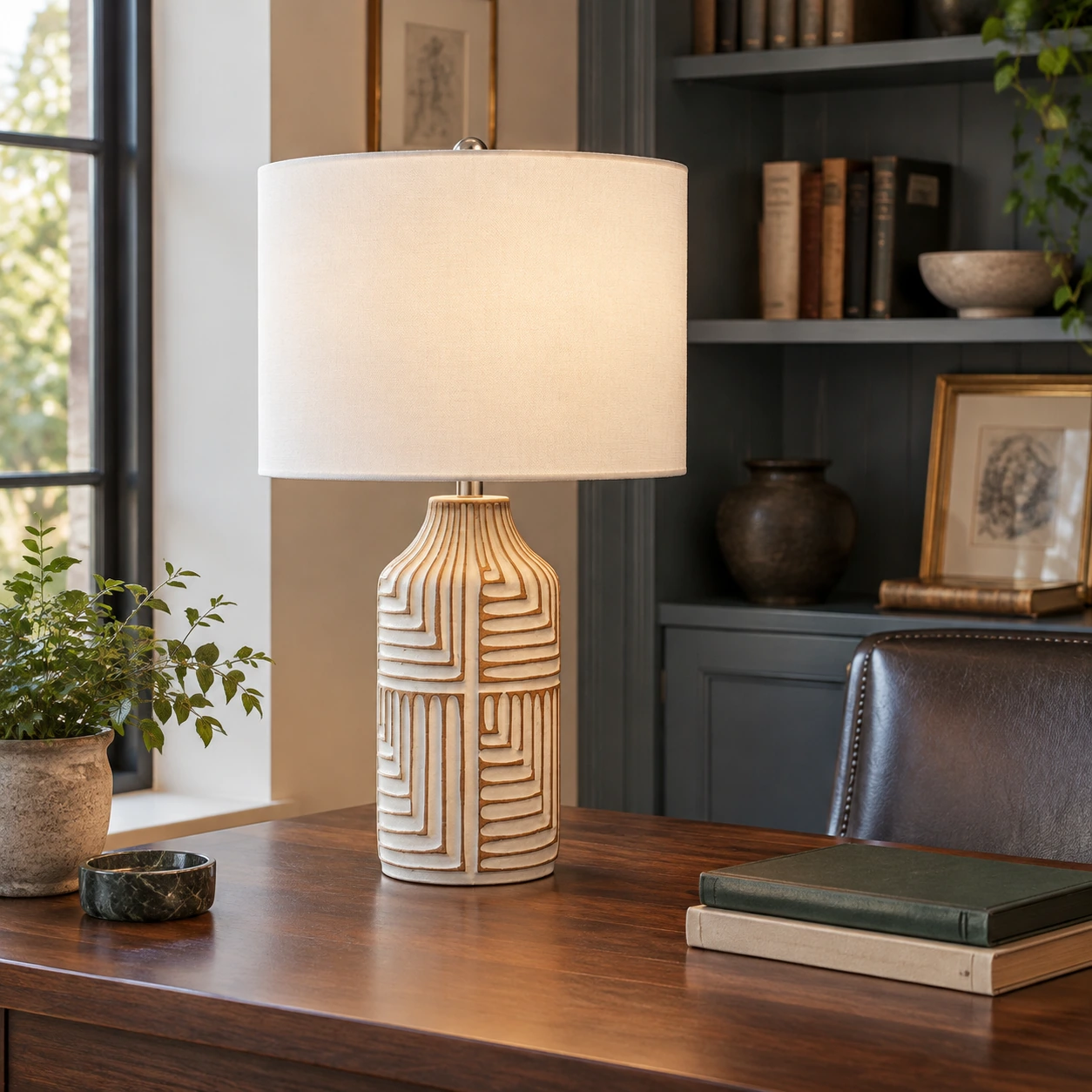 Odette table lamp on a walnut writing table in a private library