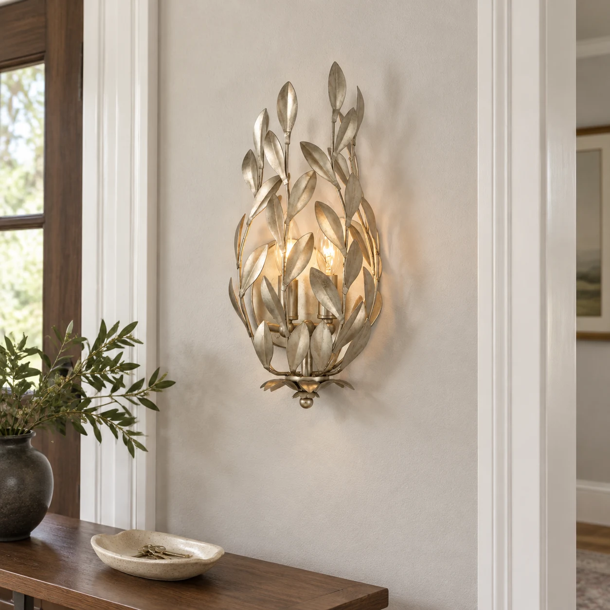 Elise silver leaf wall sconce in an ordinary American entry hall