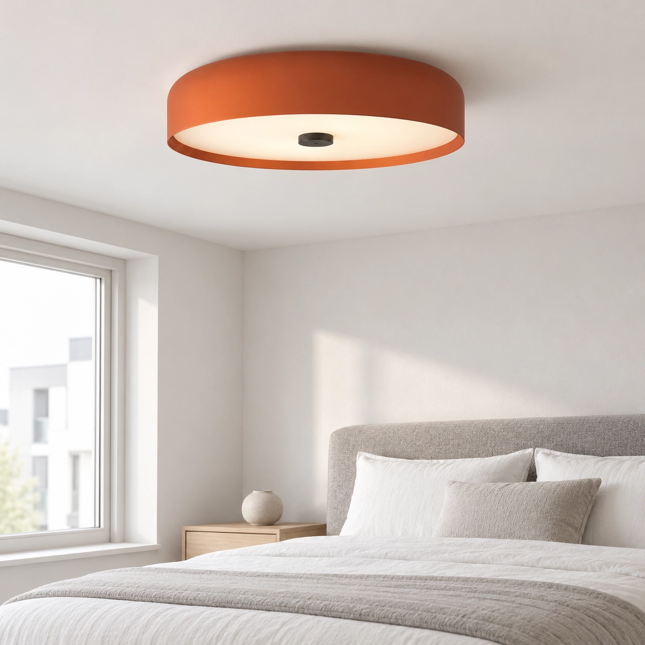 One orange Seren ceiling light in a neutral bedroom