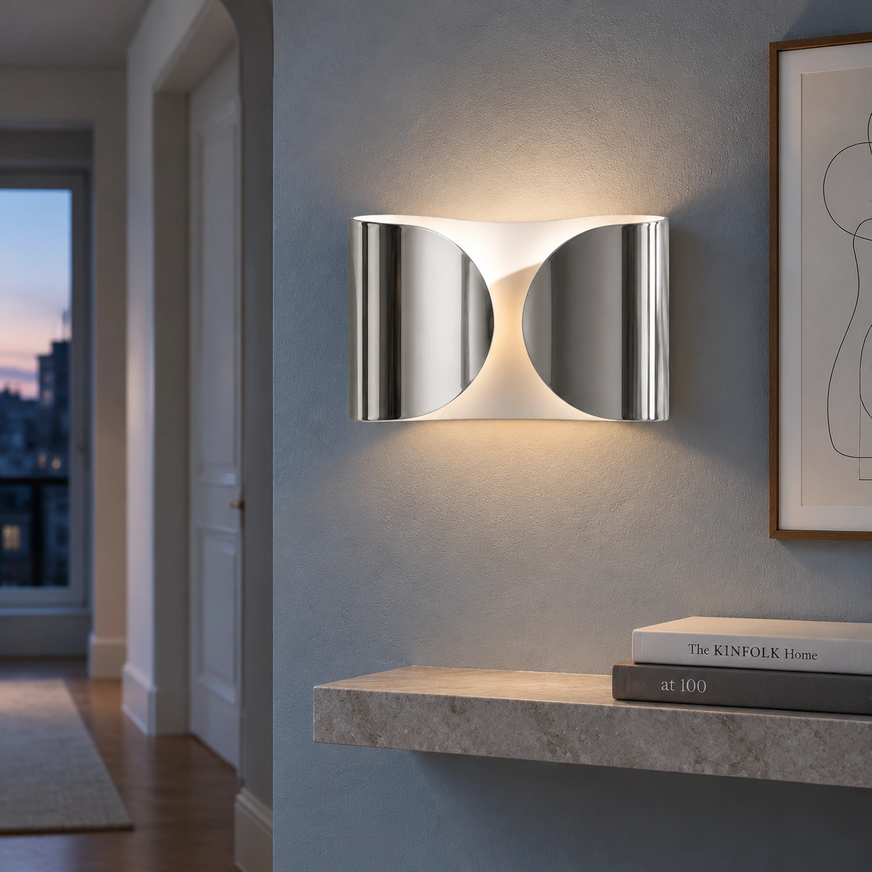 Chrome Foglio wall light in a hallway