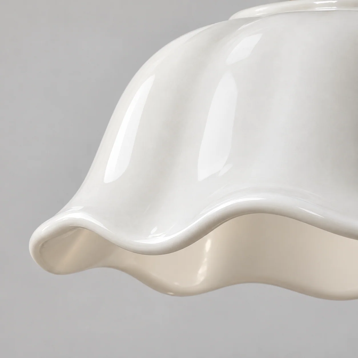 Close-up of glossy scalloped ceramic rim