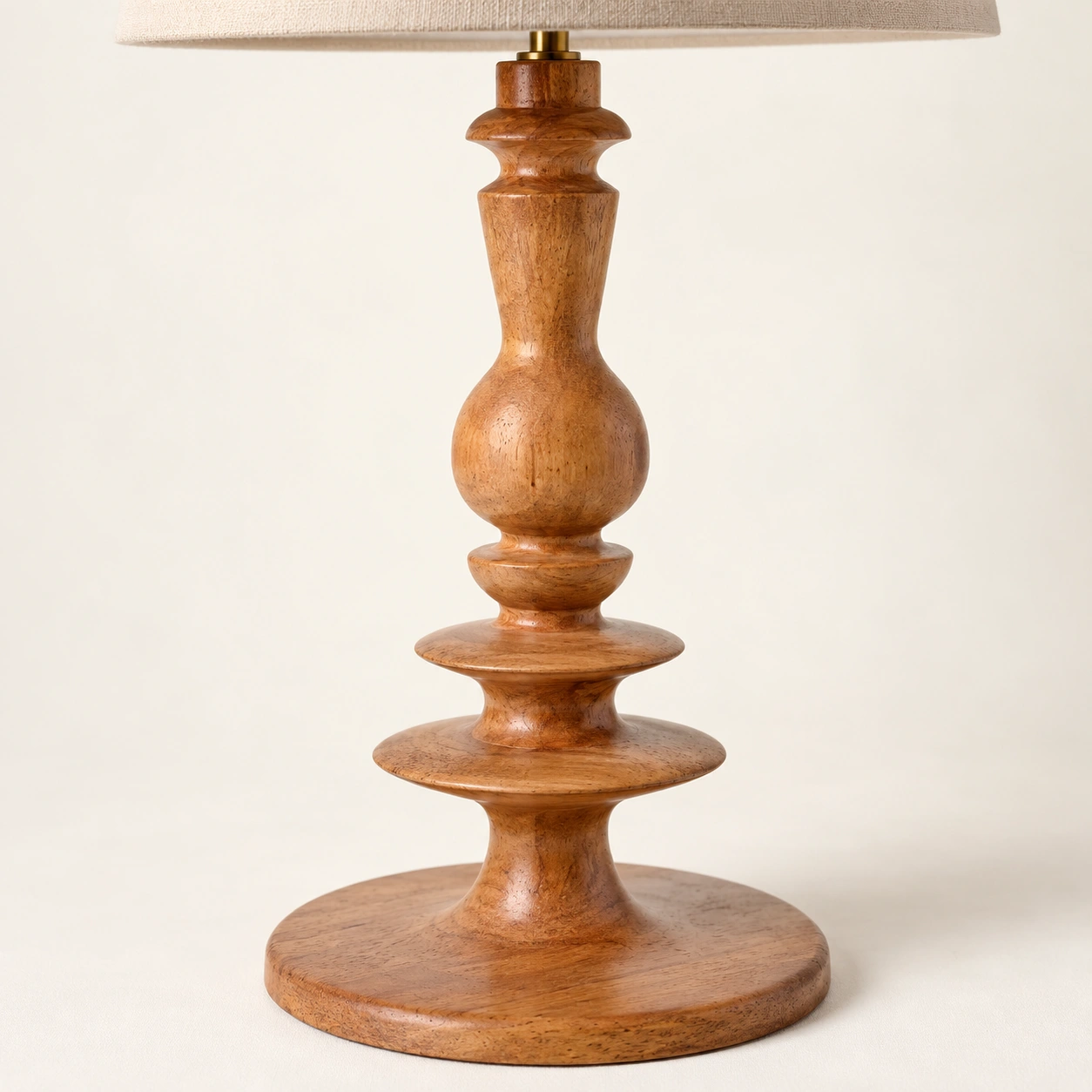 Close-up of the turned wood grain and sculpted base