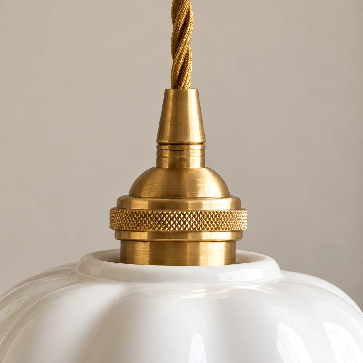 Pendant twisted cord and brass holder close-up