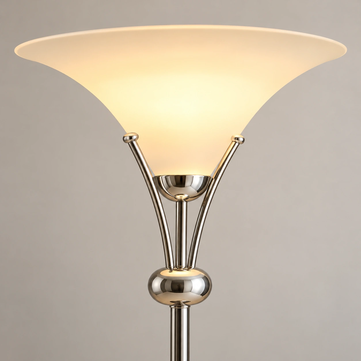 Detail of the upward bowl shade and paired chrome-finished metal supports