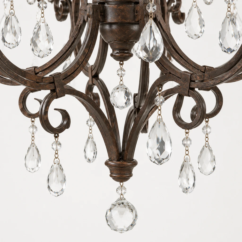 Lower iron scroll detail on the chandelier
