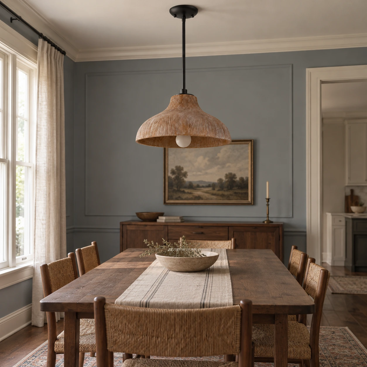Aged wood pendant light over a dining table