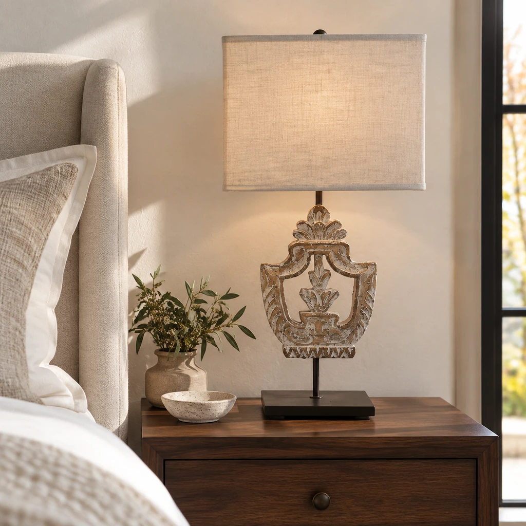 Elodie carved wood table lamp on a restrained bedside table