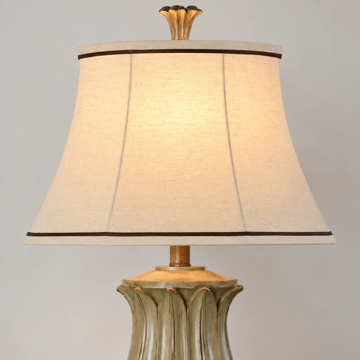 Cream fabric shade and dark trim detail of the Marlowe table lamp
