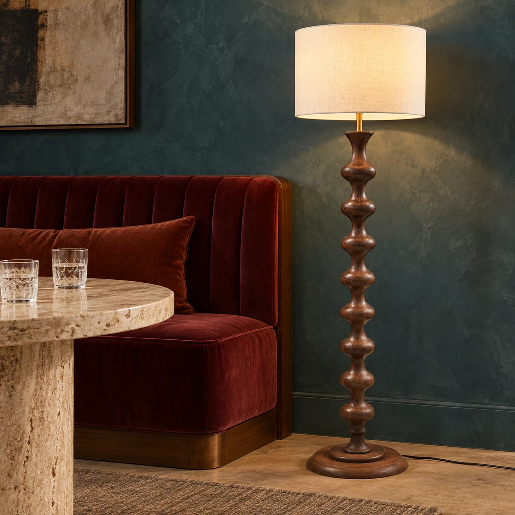 Avery sculpted walnut wood floor lamp in a boutique lounge