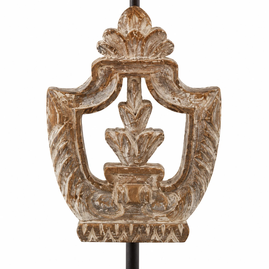Close detail of the shield-shaped carved wood body