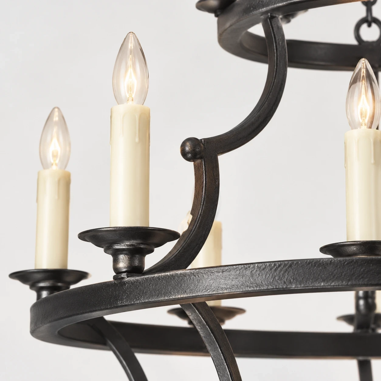 Close detail of the candle-style socket and curved arm