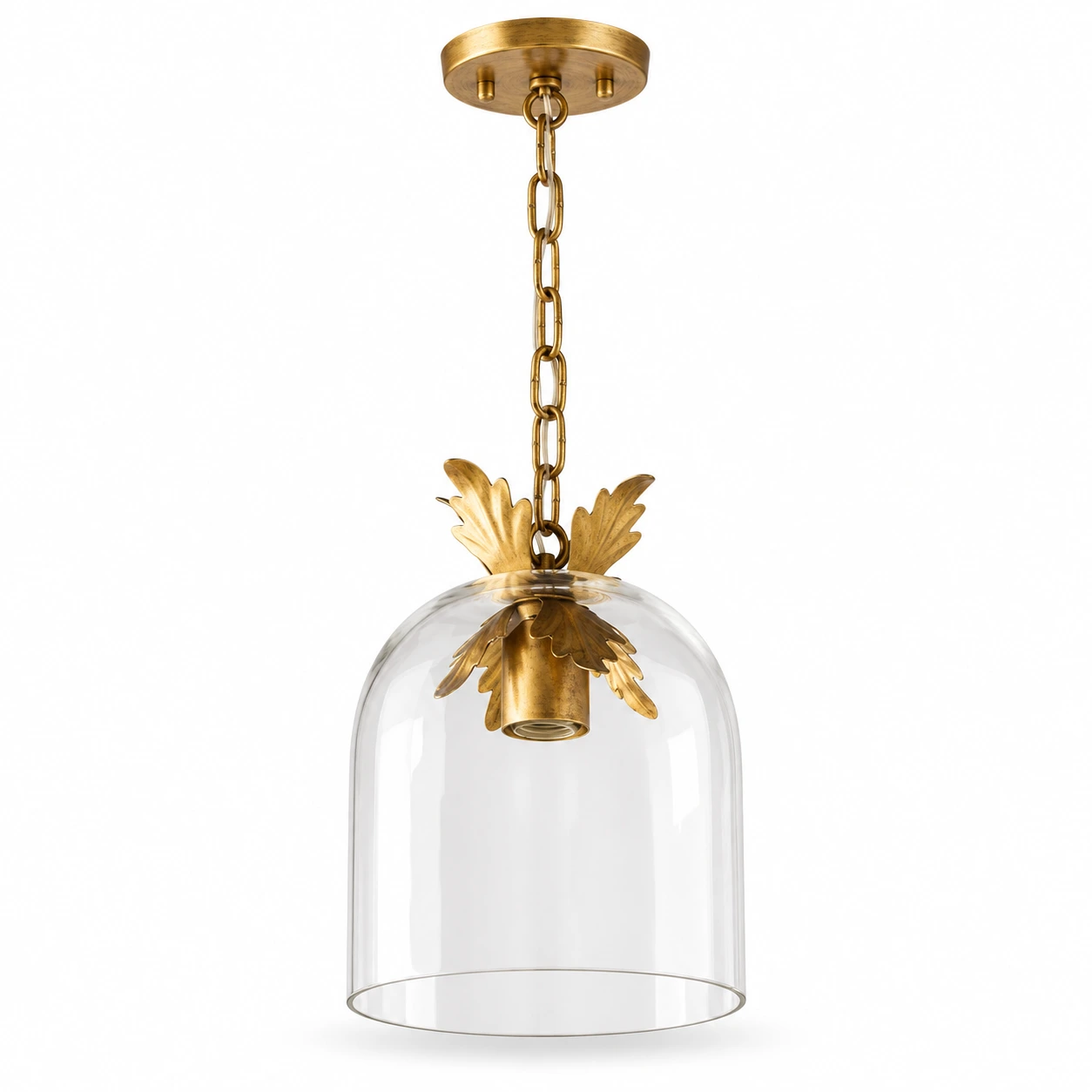 Antique gold and clear glass pendant on a white background