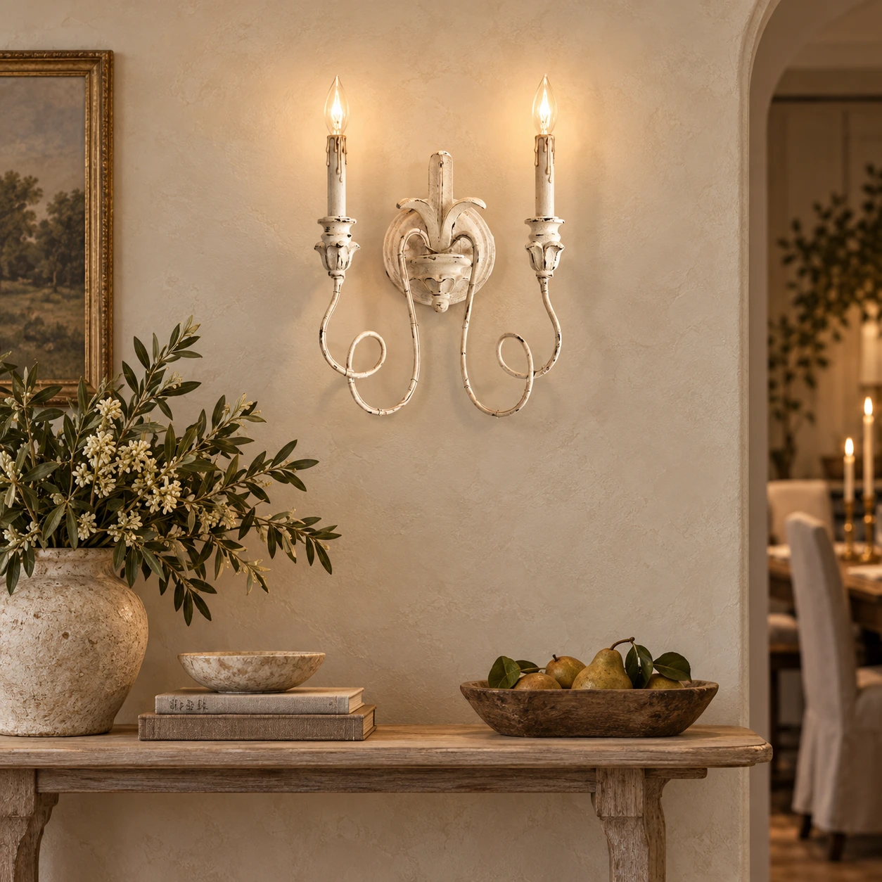 Cassia white aged two-light wall sconce above a dining console
