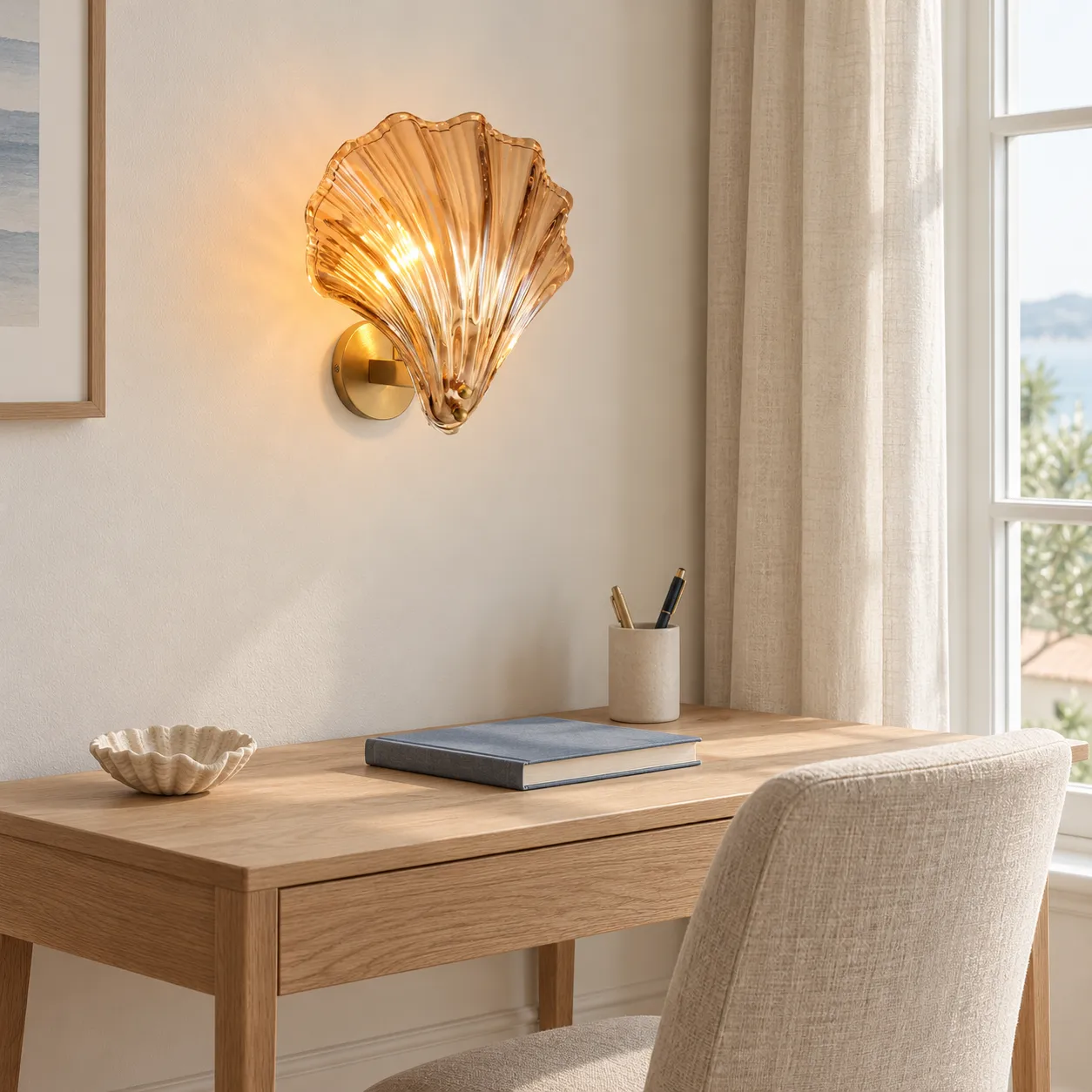 Vale shell wall light above a compact writing desk