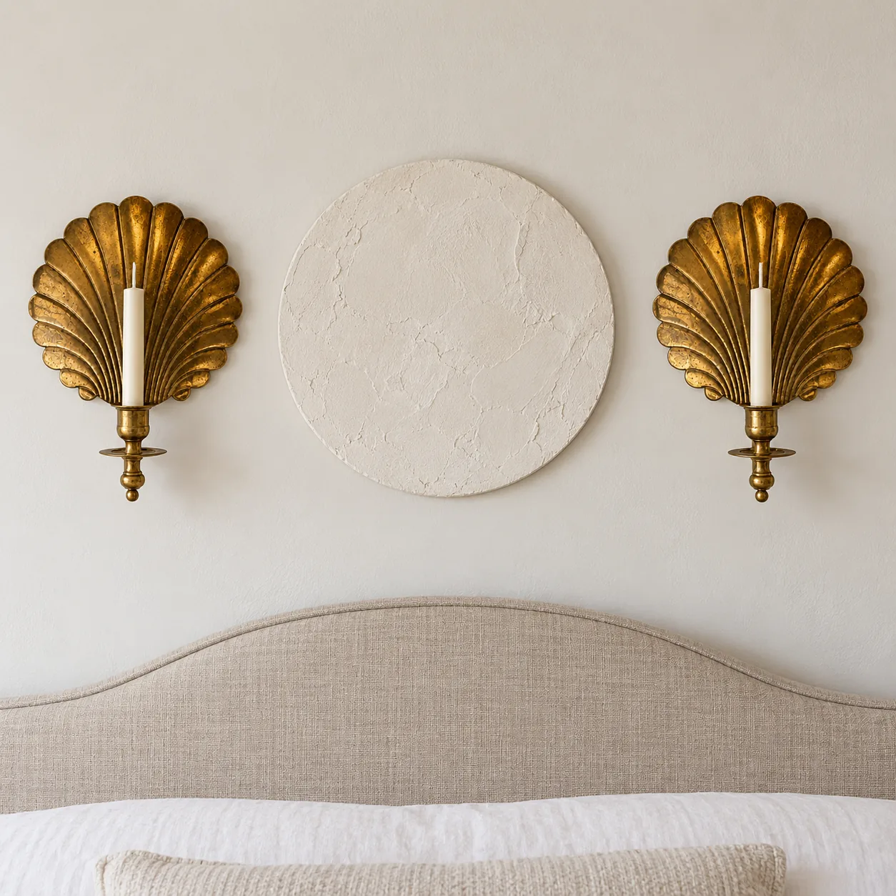 Two shell sconces on a bedroom wall