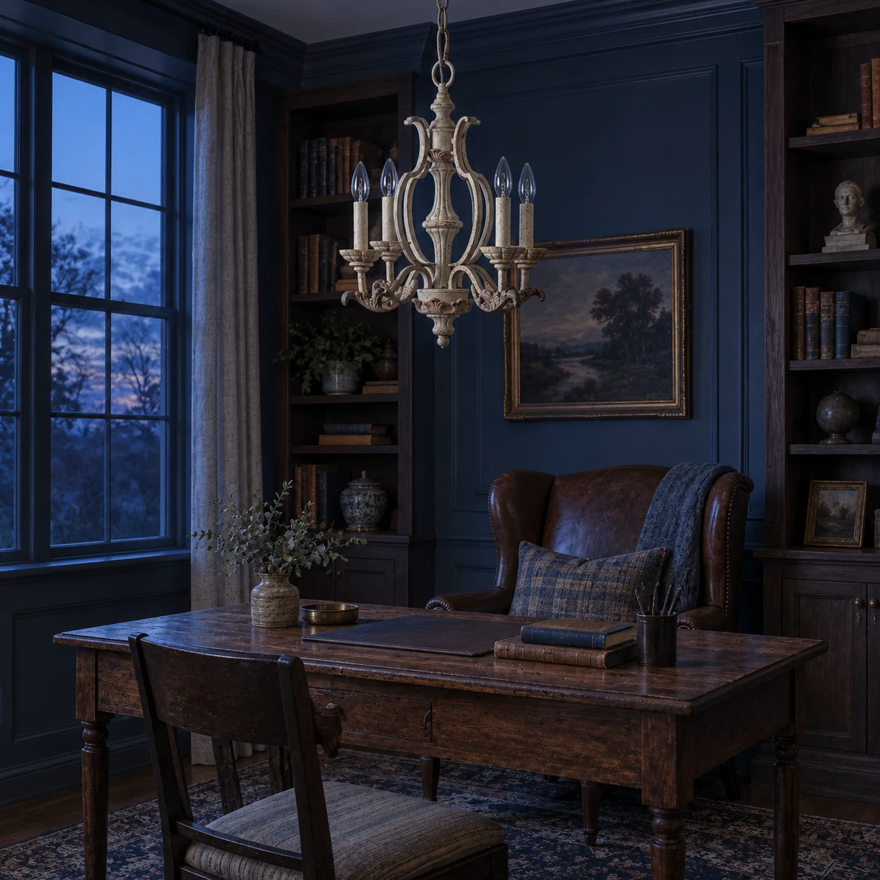 Vintage carved wood chandelier above a writing desk in a traditional American study at blue hour