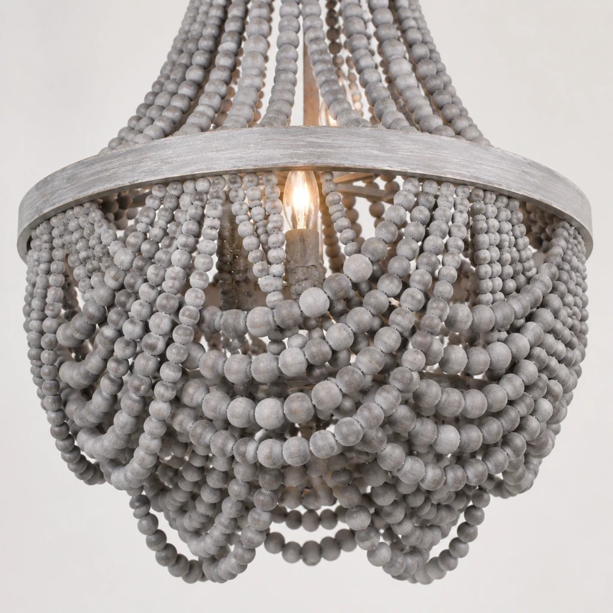 Candle-style socket and layered gray wood bead fringe detail