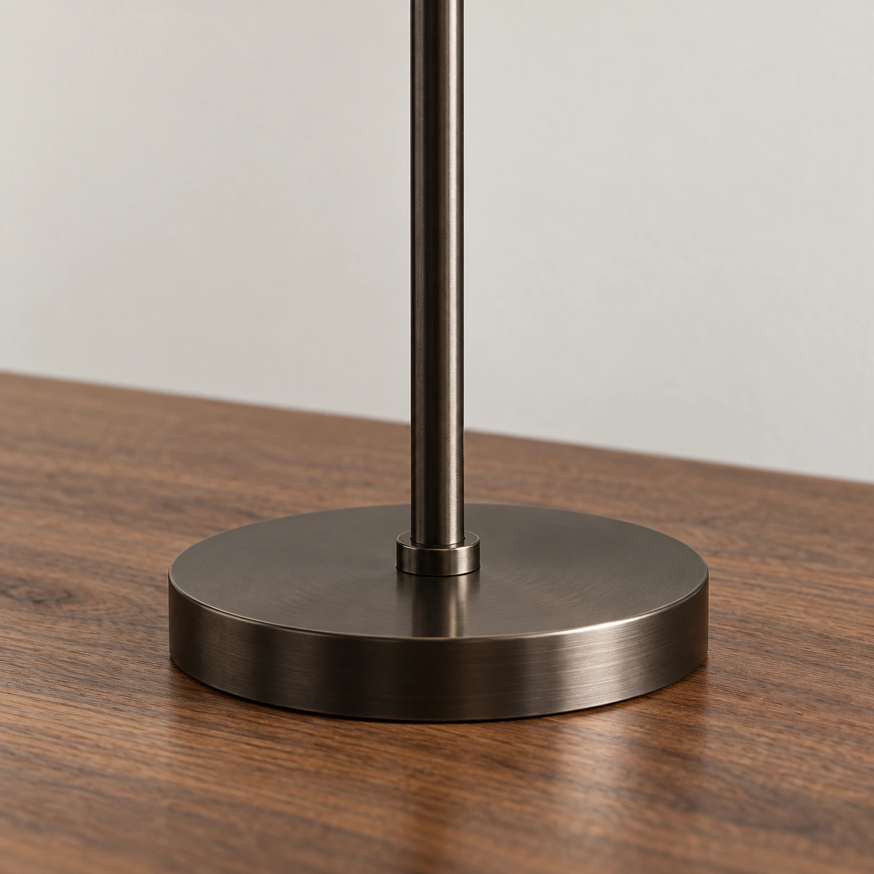 Close-up of the antique bronze stem and round base