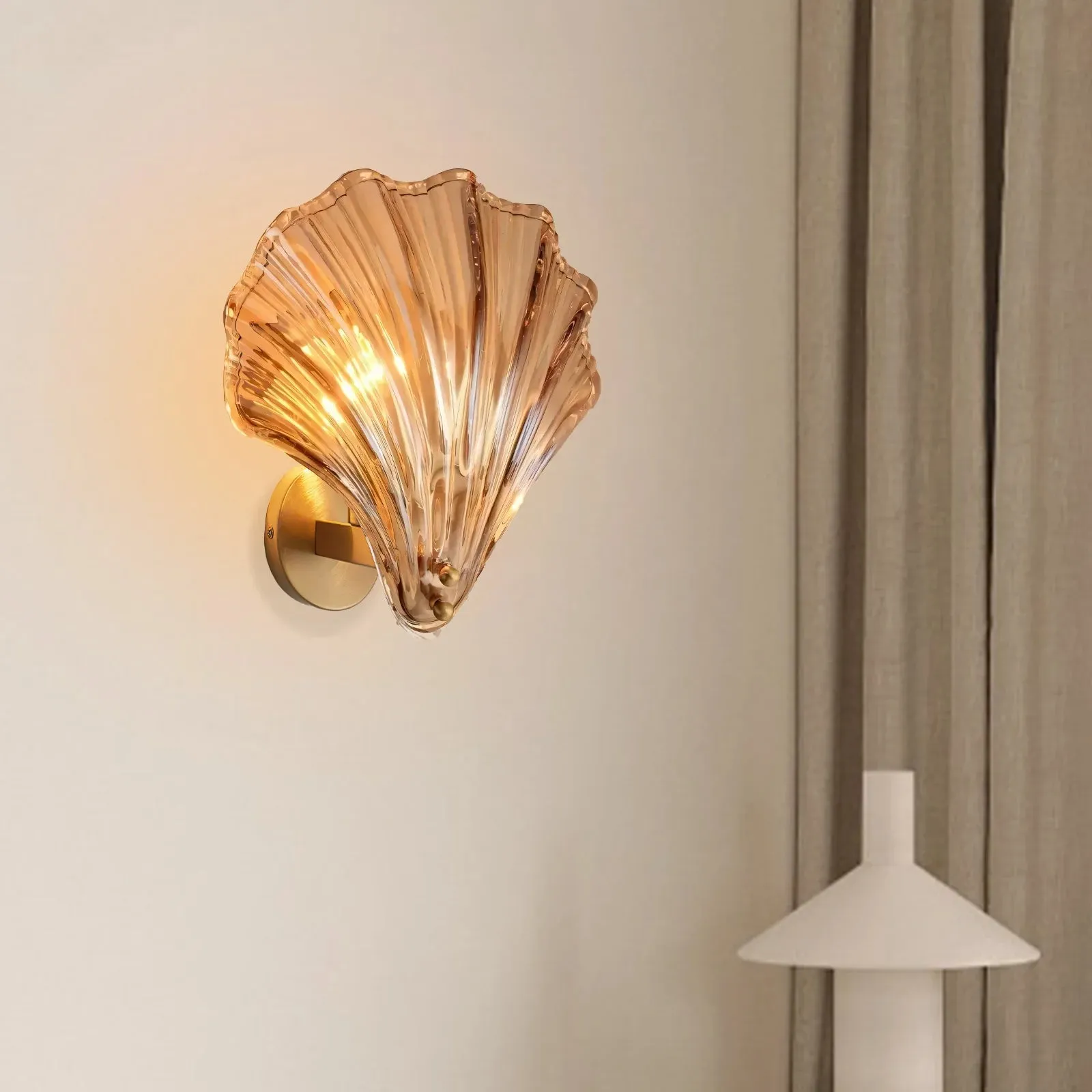 Warm glow through the amber shell glass shade