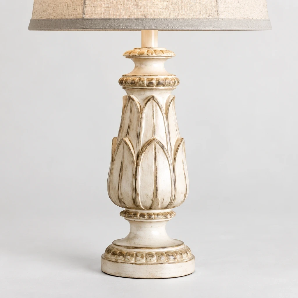 Close detail of the linen shade, carved petal panel and rounded pedestal