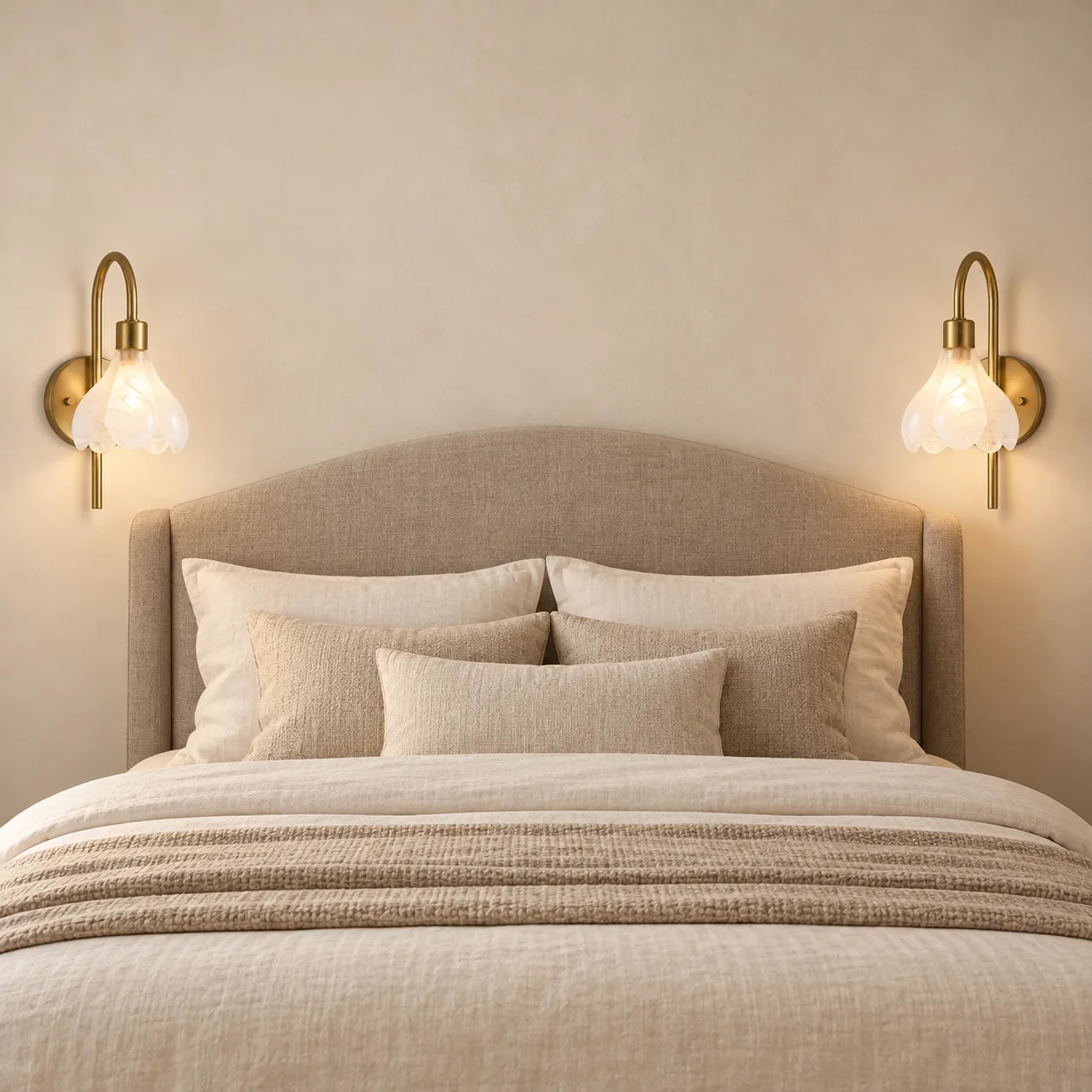 Matching wall sconces on both sides of a bed