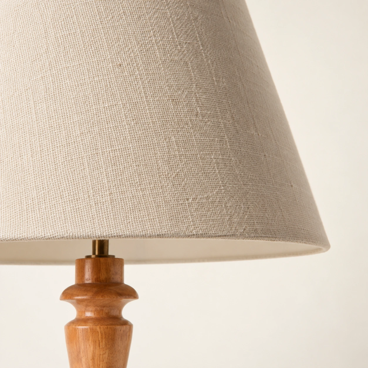 Close-up of the cream fabric weave and shade rim