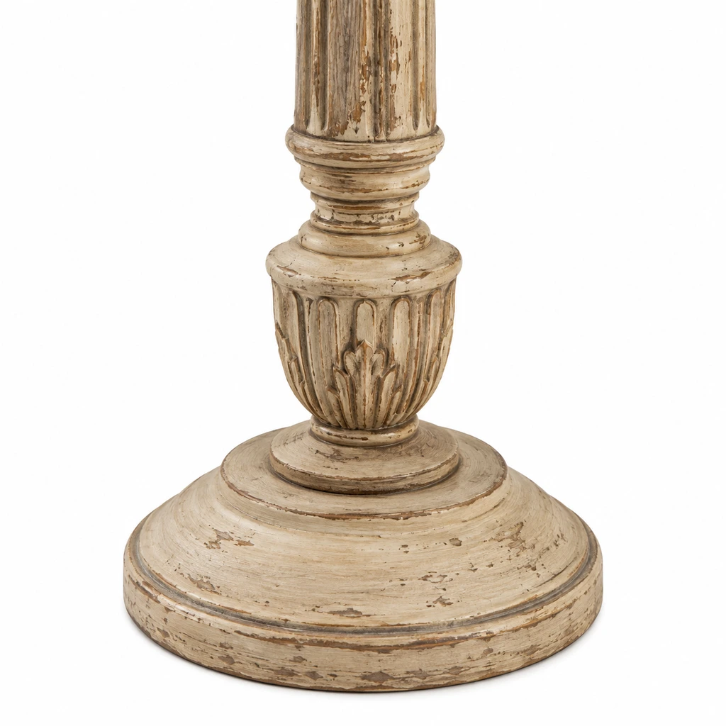 Close detail of the carved lower collar and stepped round base