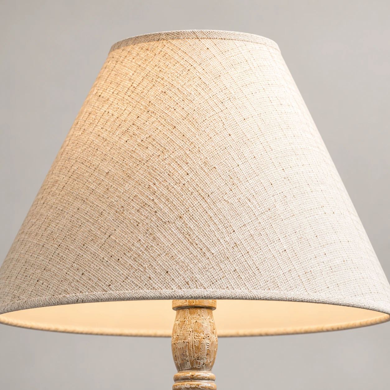 Close detail of the cream tapered fabric shade