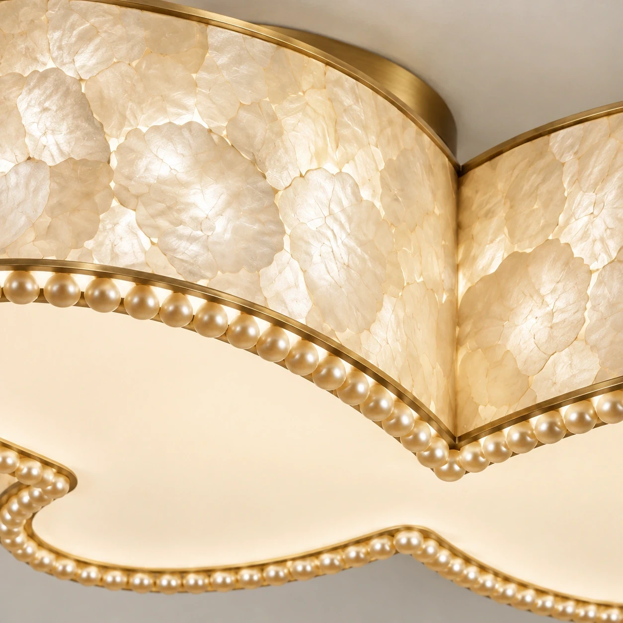 Close view of translucent shell mosaic and pearl-like trim