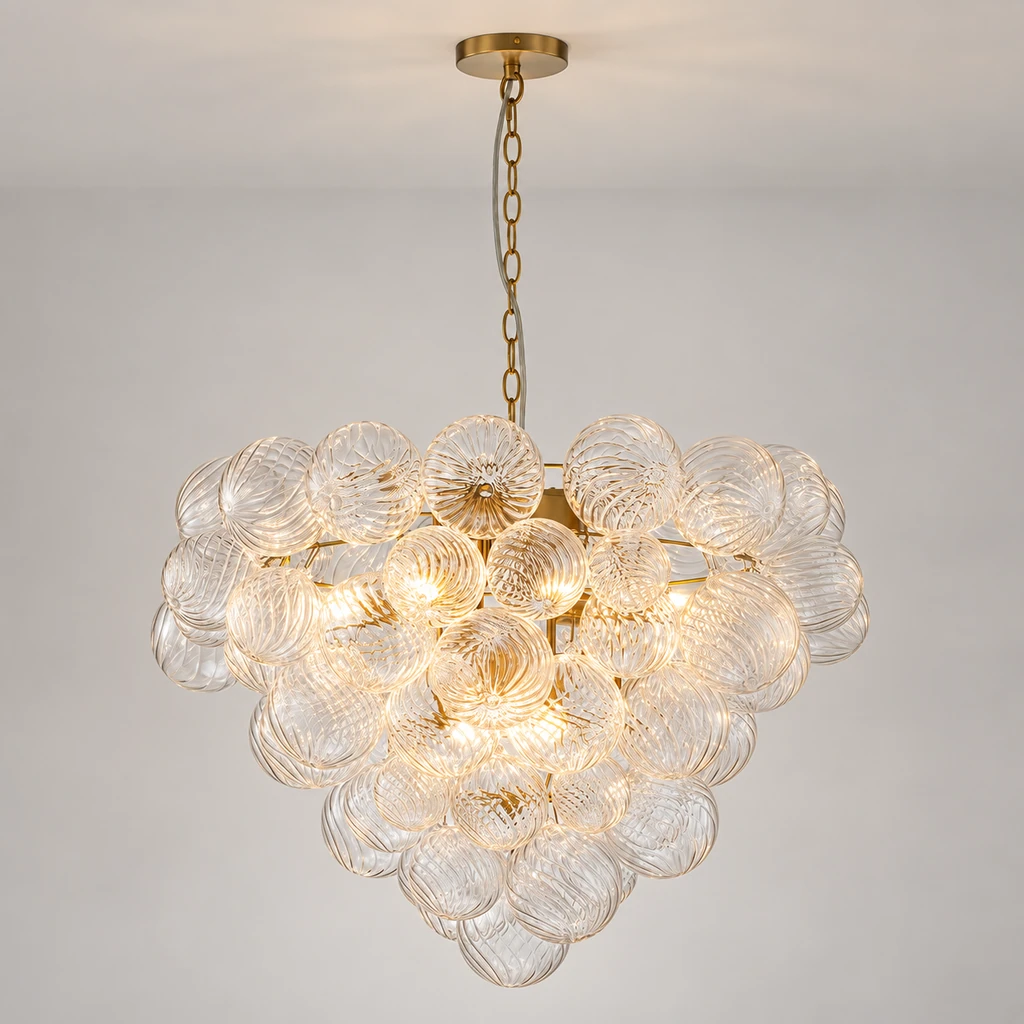 Amelie nine-light glass bubble chandelier illuminated in a neutral studio