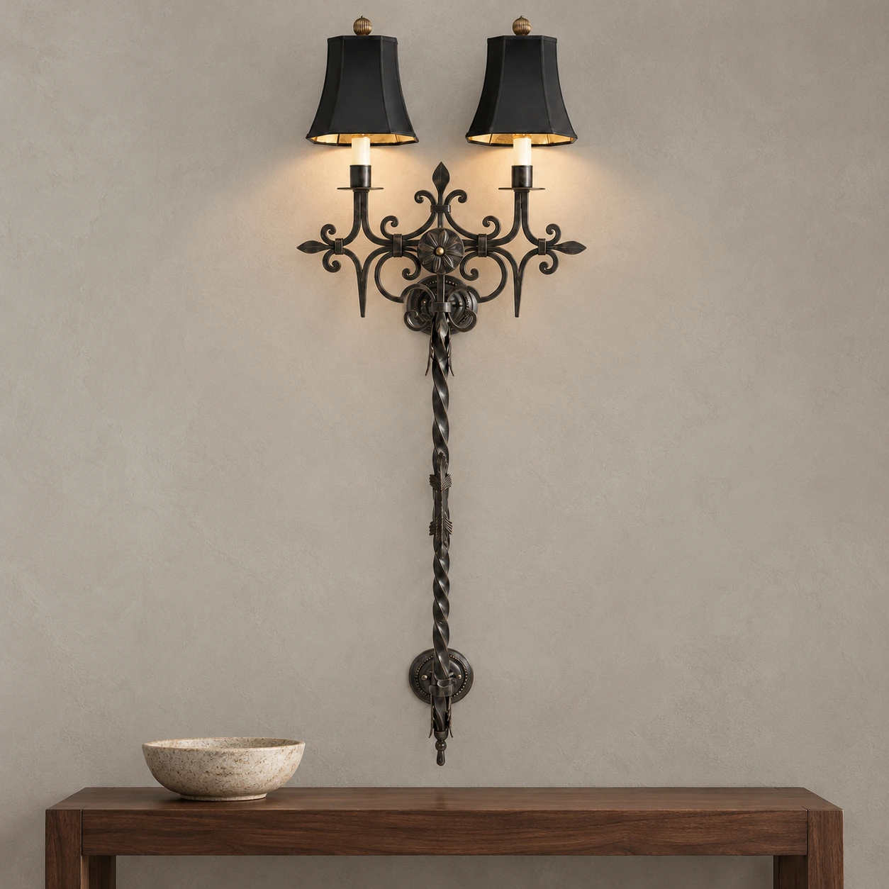Wall sconce above a walnut console