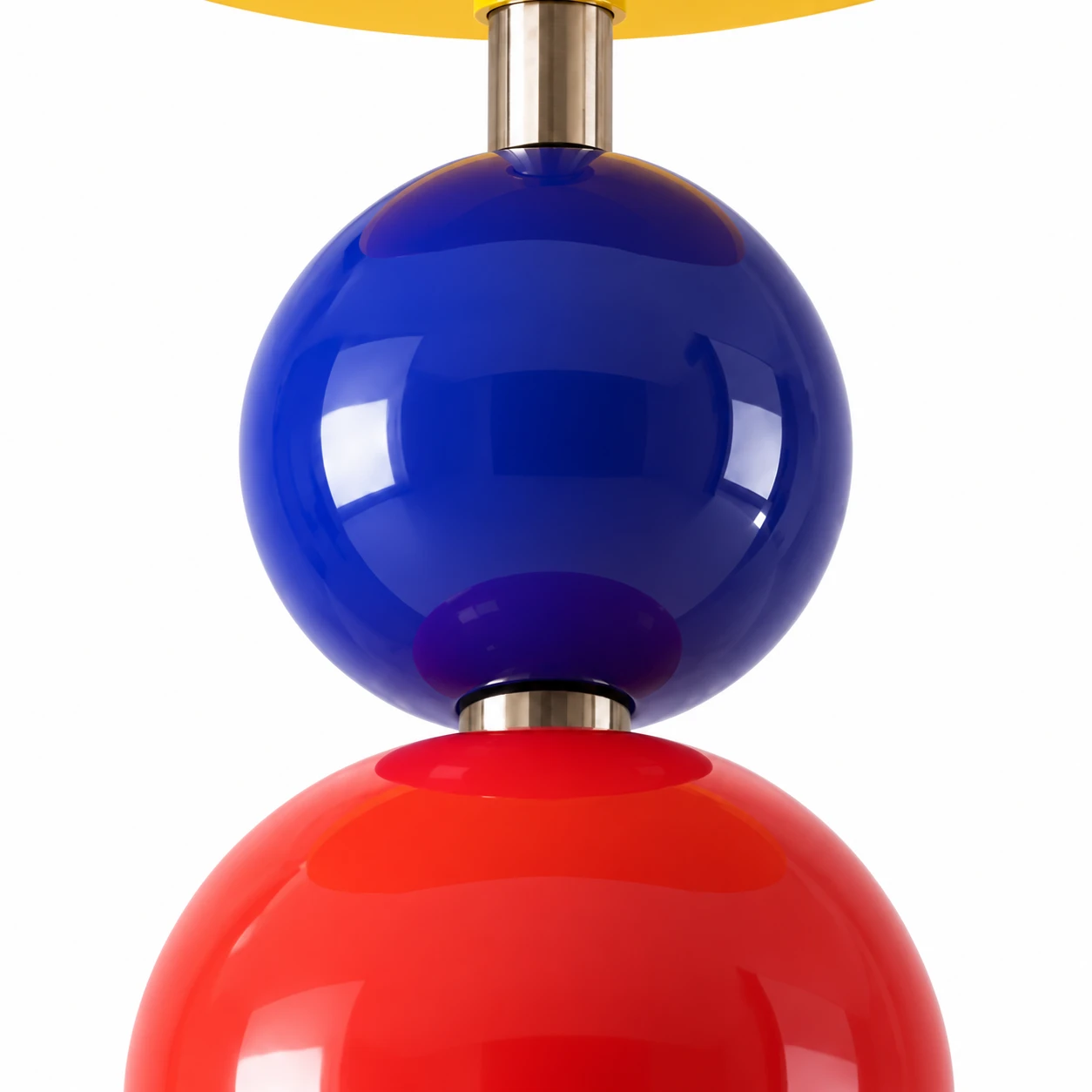 Close detail of blue and red metal orb accents
