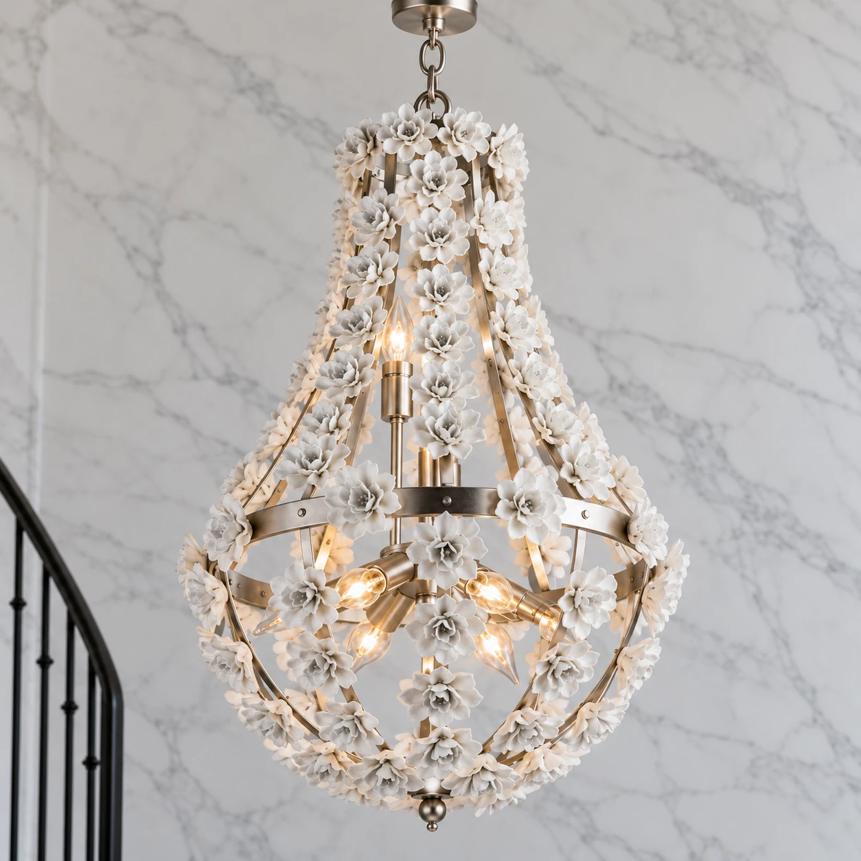 Close view of the silver floral teardrop chandelier on gray marble