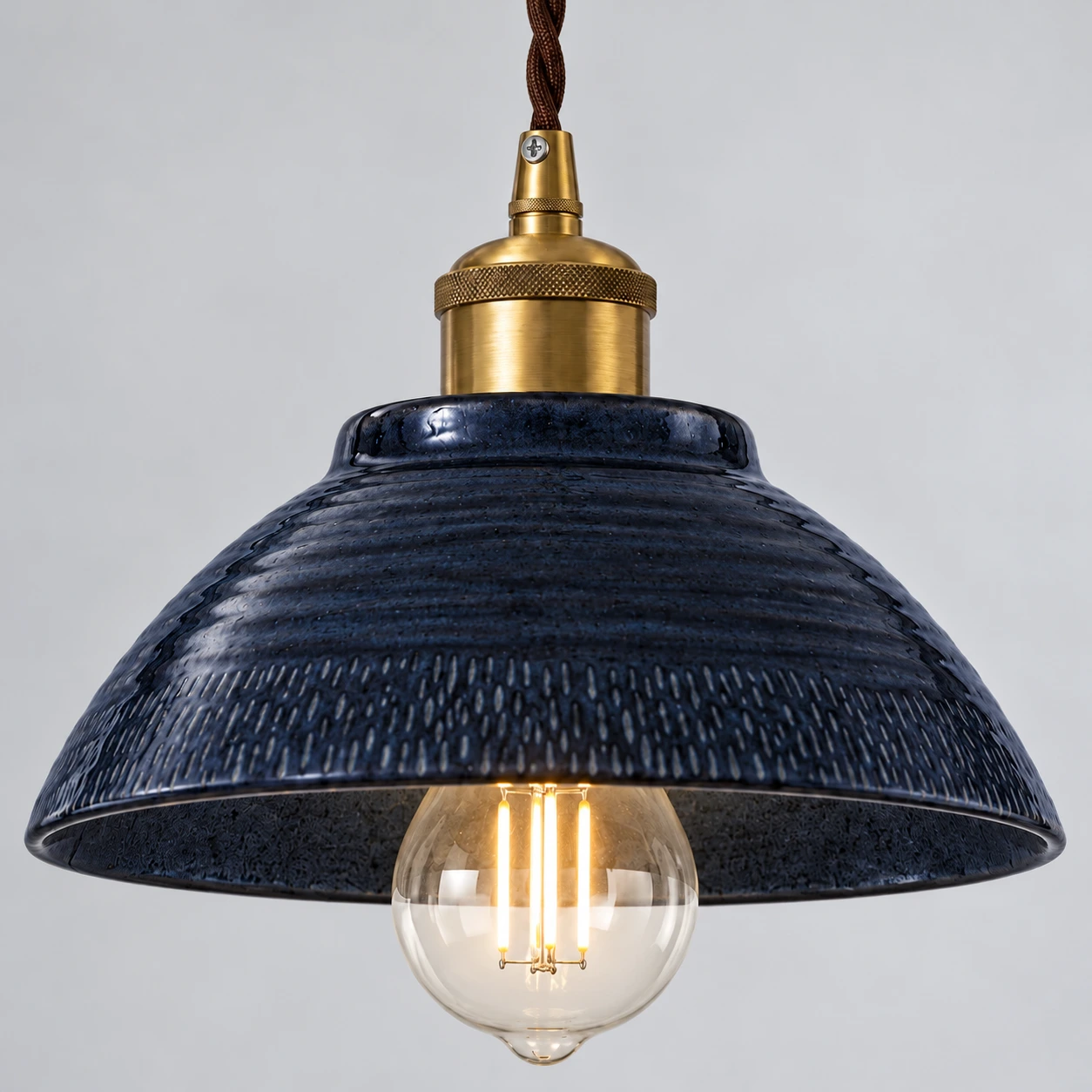 Gold-tone alloy fitting and twisted cord detail