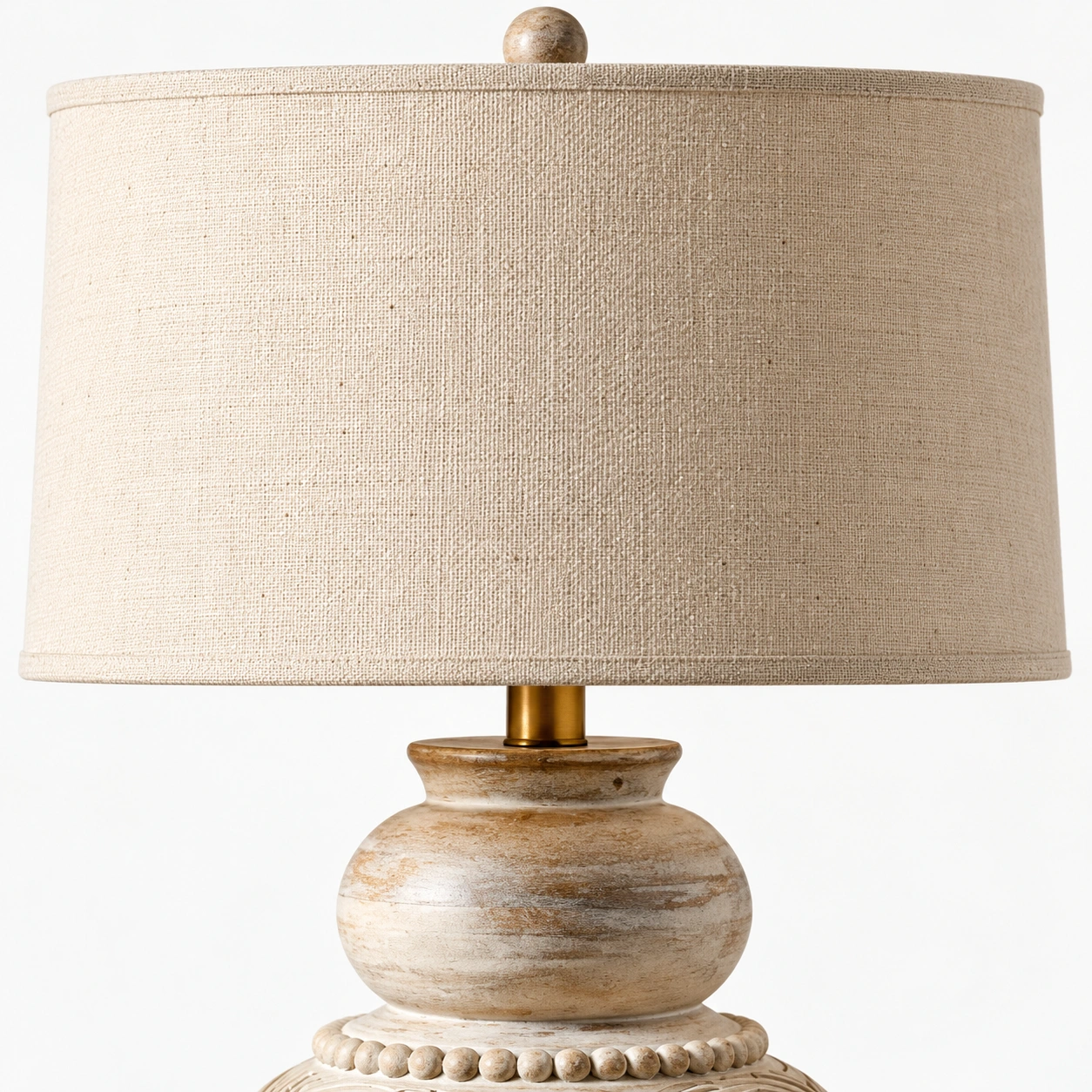 Close view of the linen shade, finial, and brass neck on the B table lamp