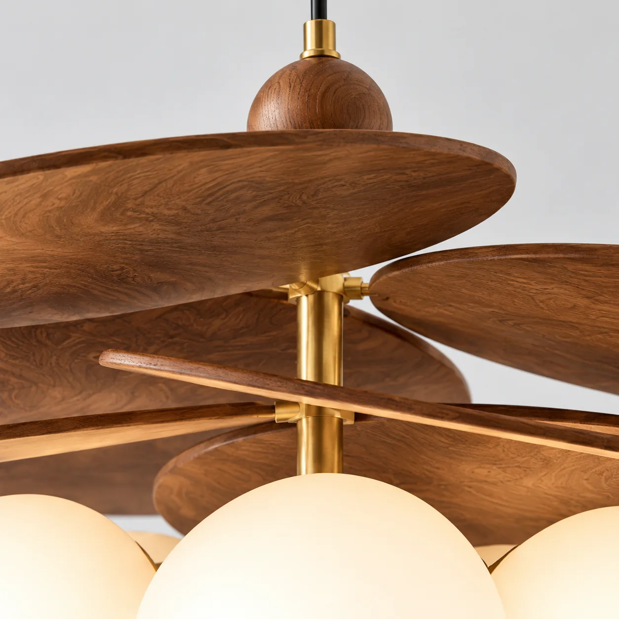 Close view of the walnut discs and brass joints