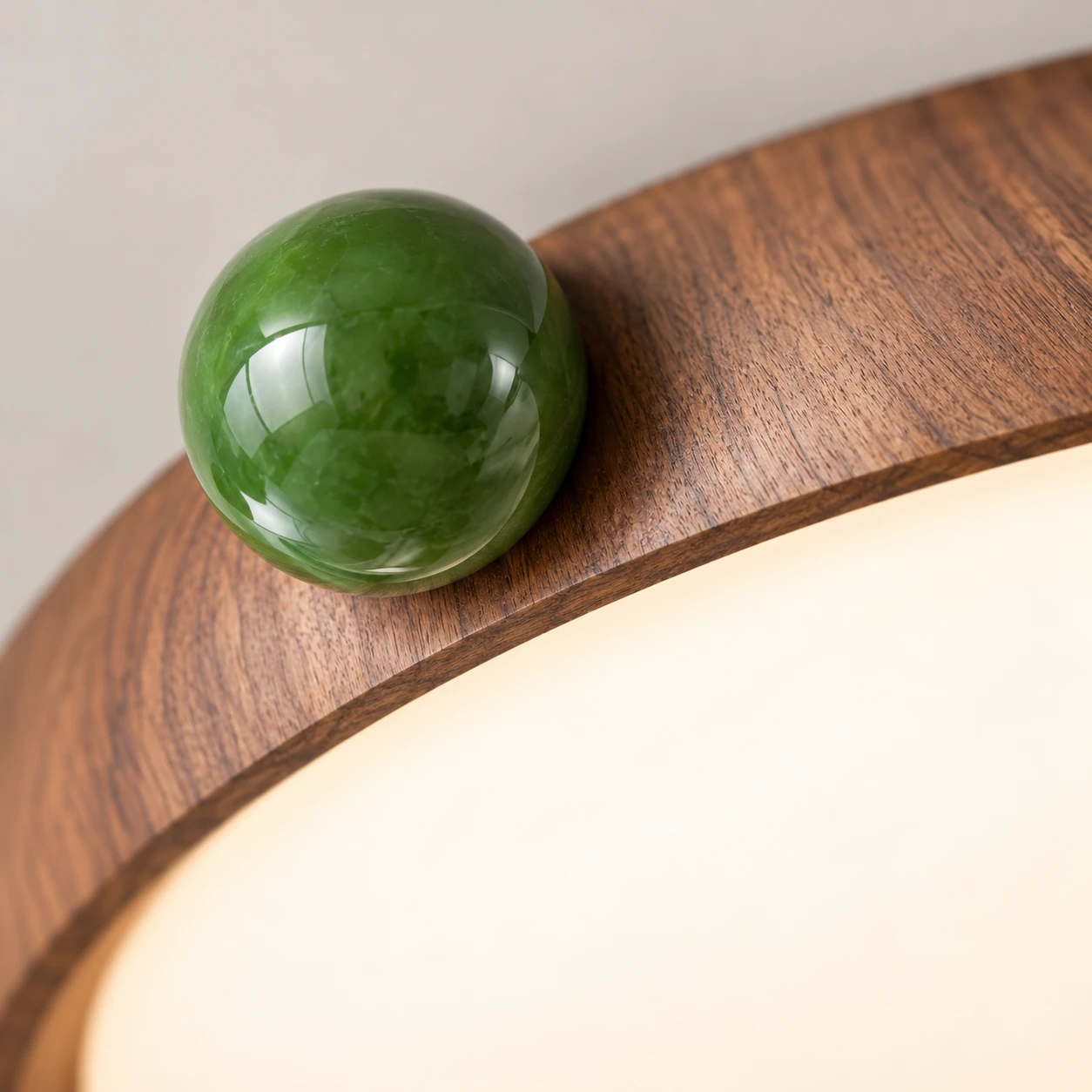 Walnut rim and green sphere accent detail