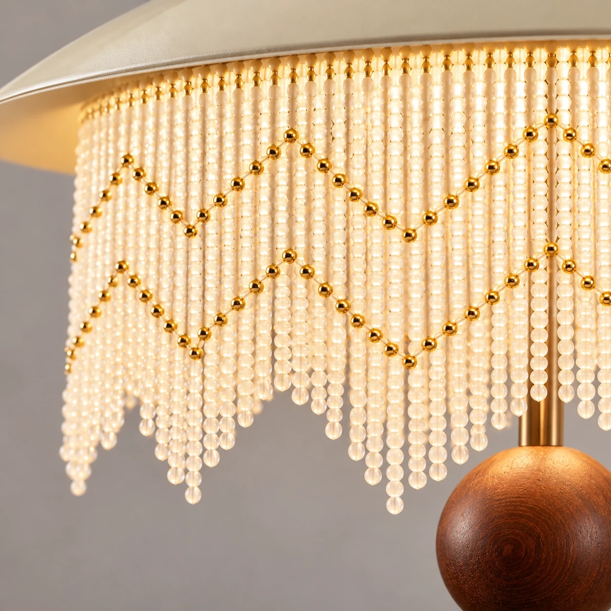 Close view of the cascading beaded fringe with gold accent beads
