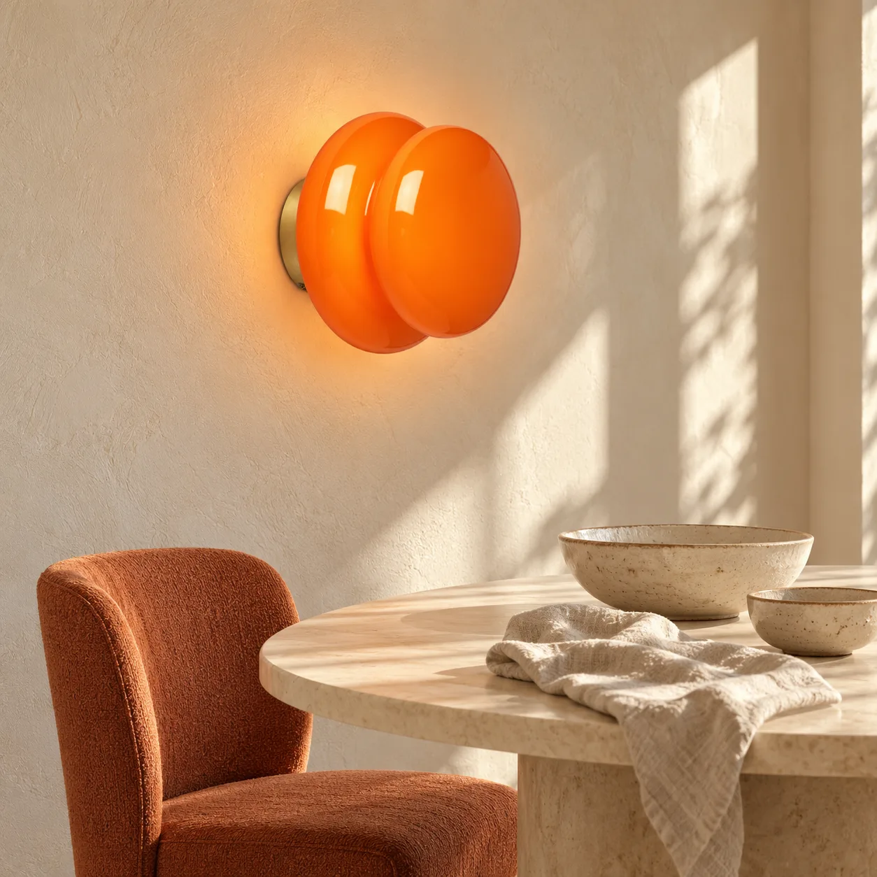 Orange wall light in a dining room